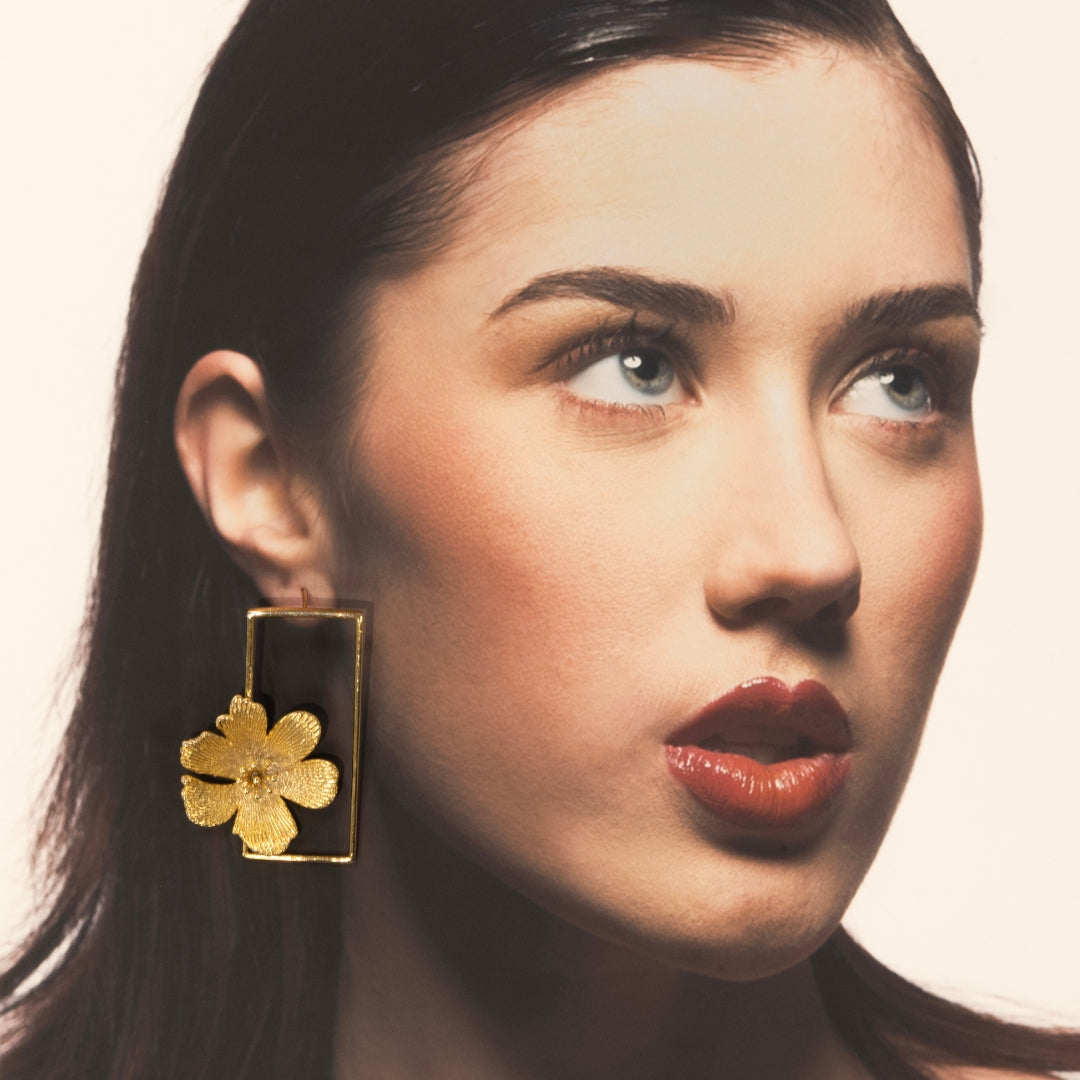 Model wearing gold floral rectangle earrings – bold botanical statement from Bloom Collection by House of Kiash