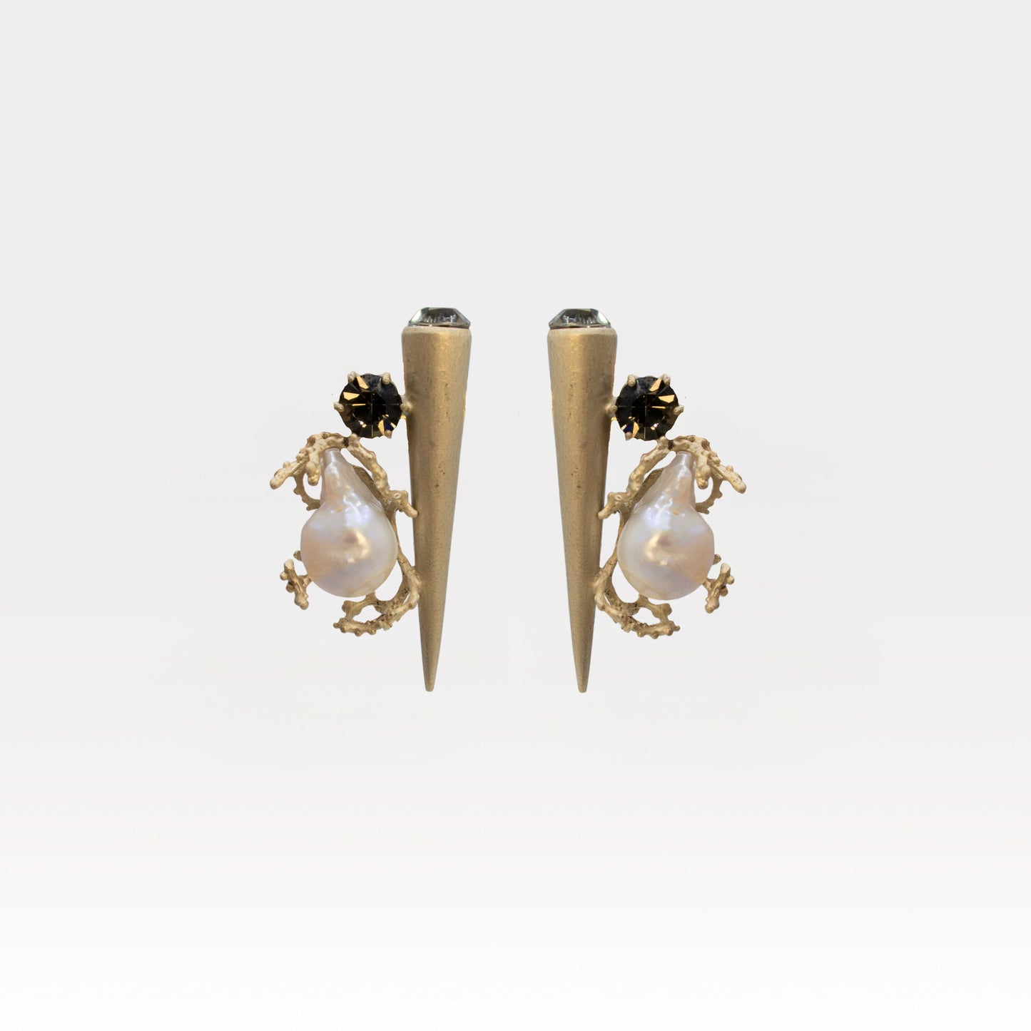 House of Kiash Elena Studs featuring a baroque pearl and black Swarovski crystal with a tapered pin in 18K dull matte gold plating.