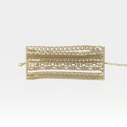 Gold bracelet with various links on a white background