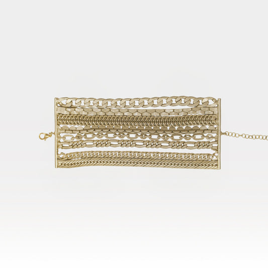 Gold bracelet with various links on a white background