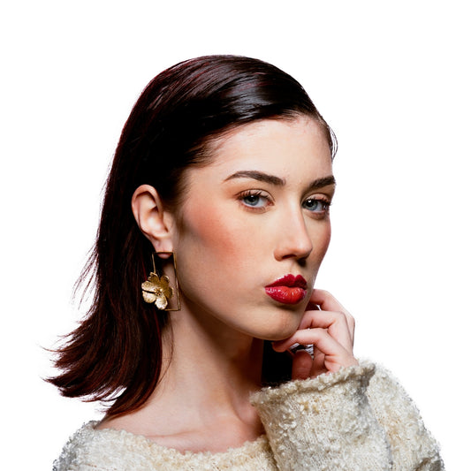 Profile view of model wearing Bloom Collection floral rectangle earrings – nature-inspired gold statement jewelry