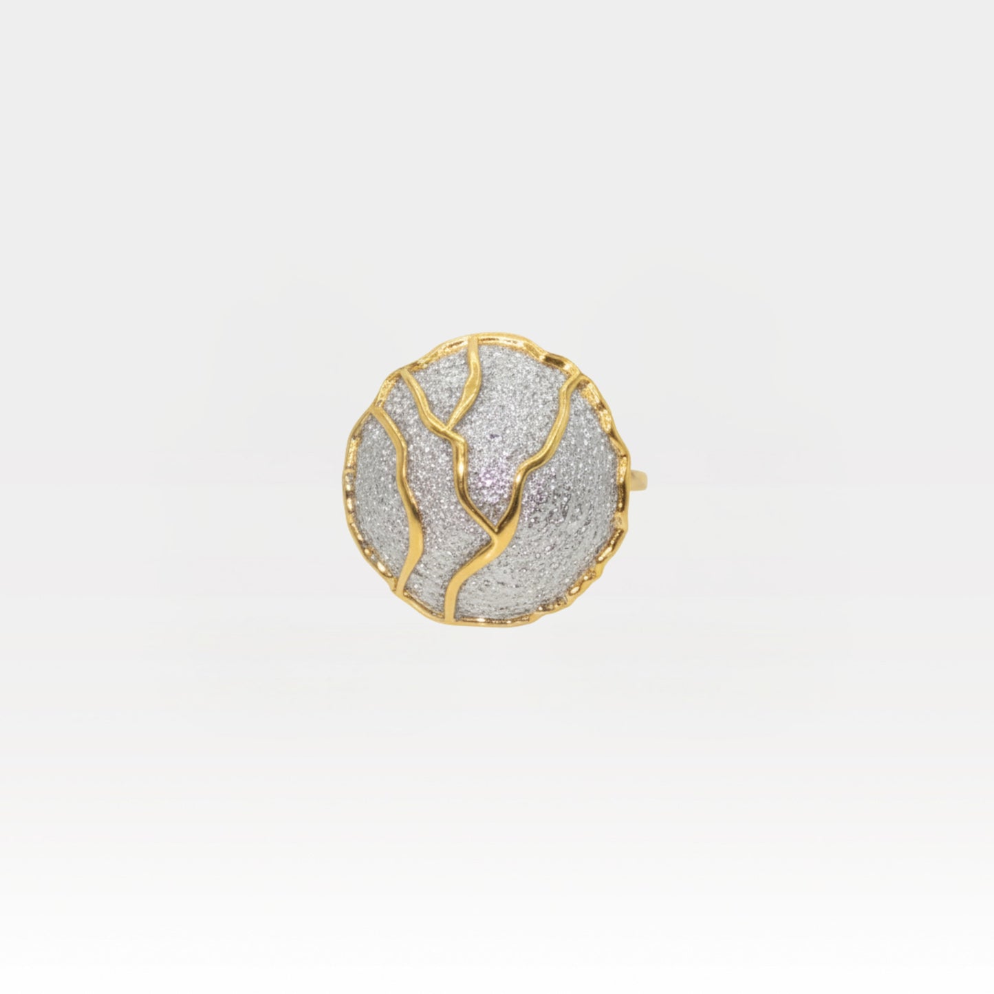Kintsugi-inspired statement ring with textured silver disc and gold veining, Japanese art jewelry