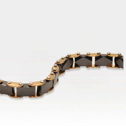 Rose gold and faceted black ceramic link bracelet with a luxurious design.
