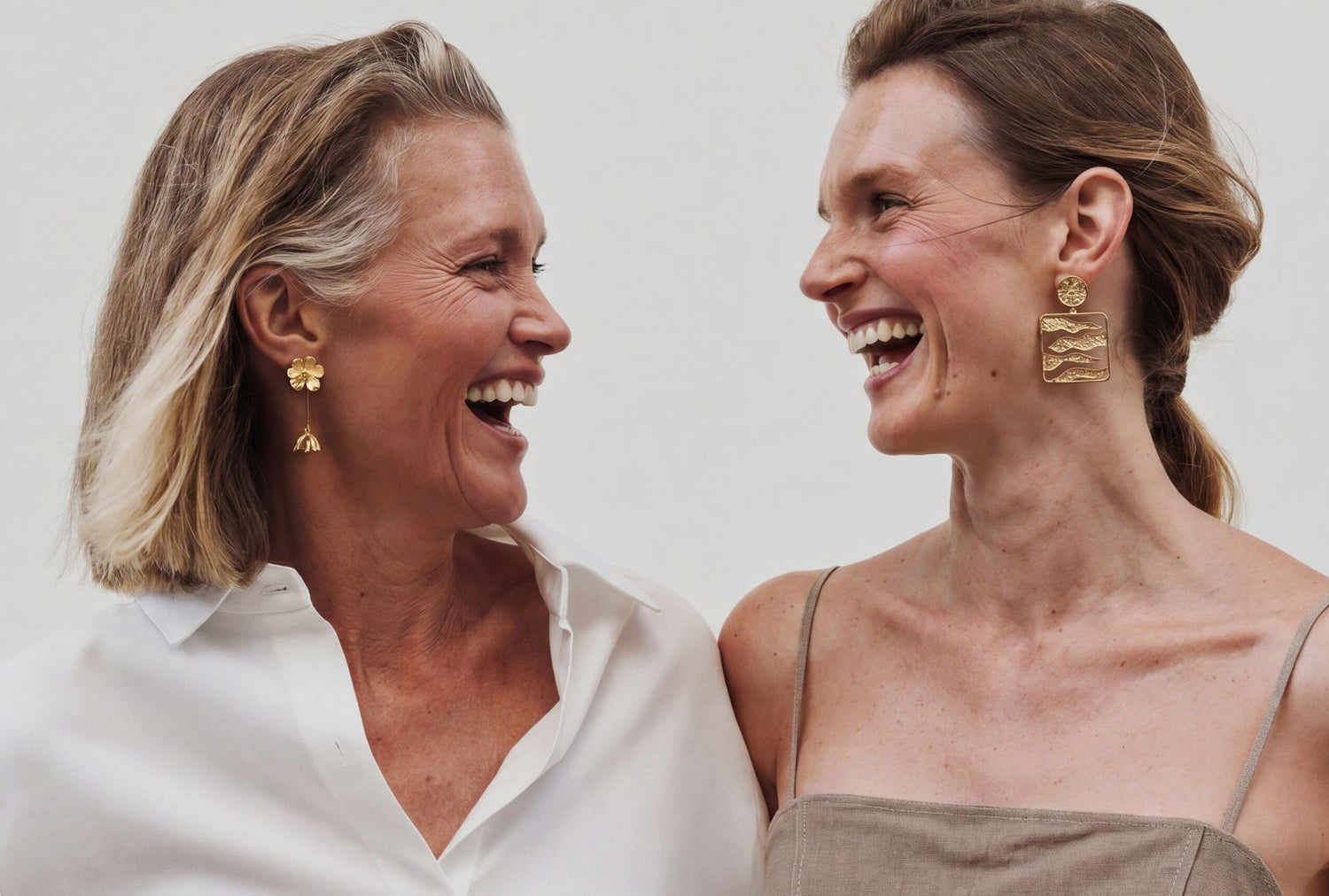 Two women laughing together with a text overlay about Mother's Day.