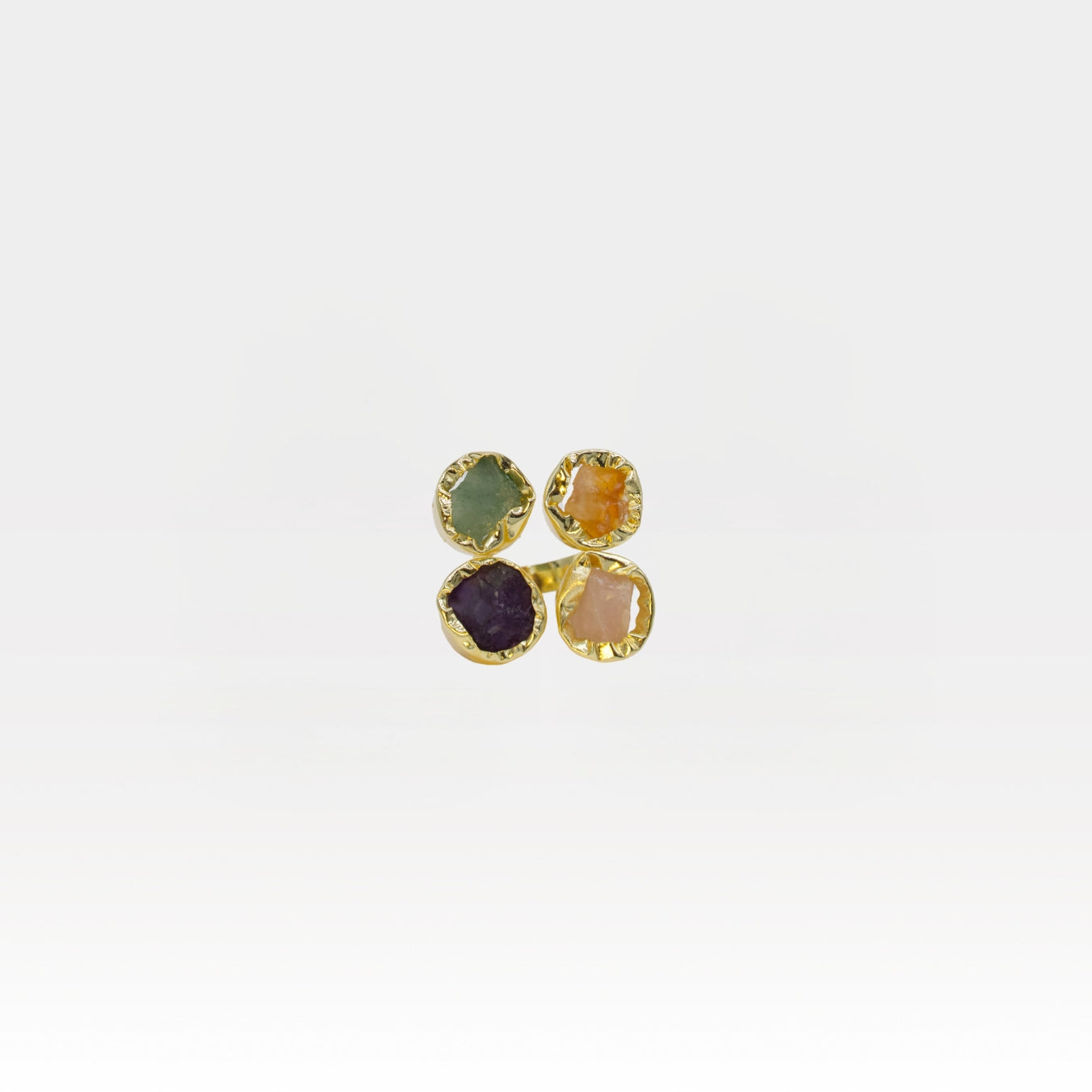 Set of four gemstone ring on a white background